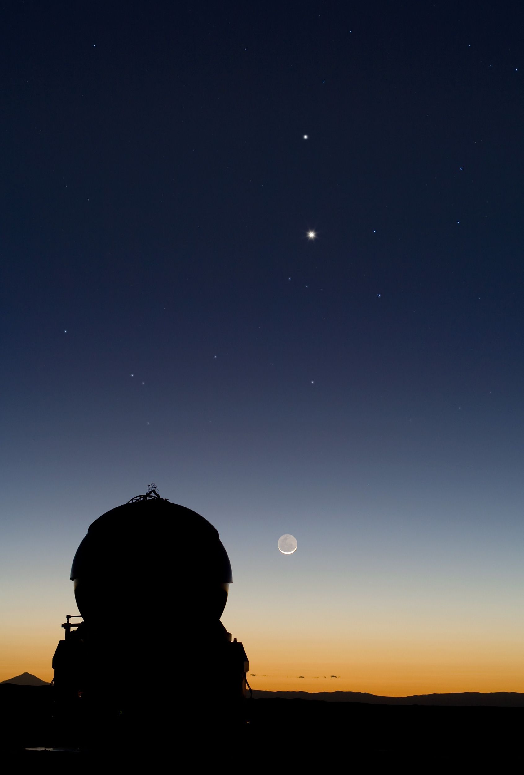 Mercury and Venus aligned above the moon.